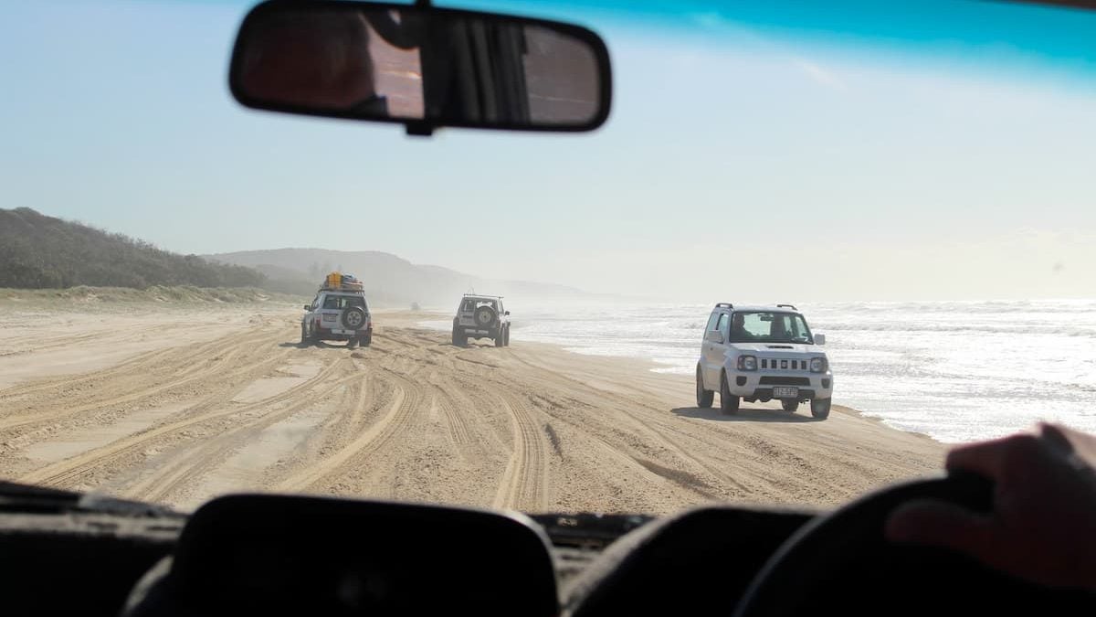 Driving on Noosa Beach.