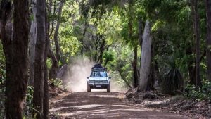 Your Ultimate West Coast Australia Road Trip Guide 2024. A 4wd travels through the backroads of the Margaret River wine regions in Western Australia