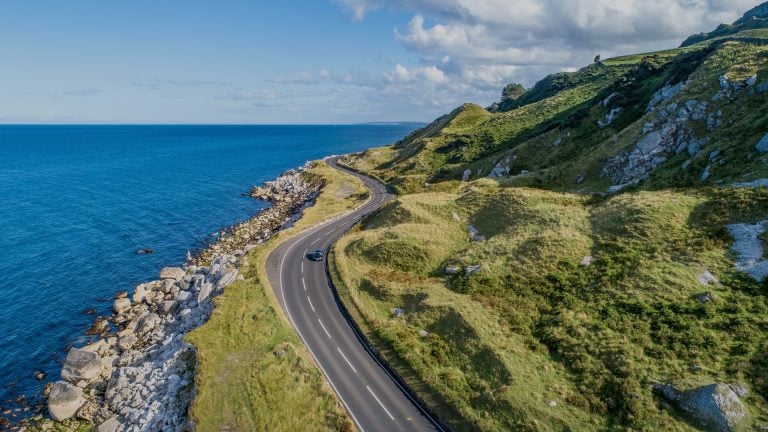 single road winding around a uk coastal getaway