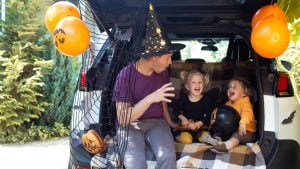 Family Halloween outing in a car
