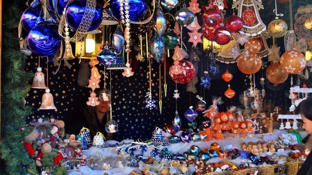 A Christmas stall adorned with festive decorations and handcrafted gifts in Vipiteno, Italy