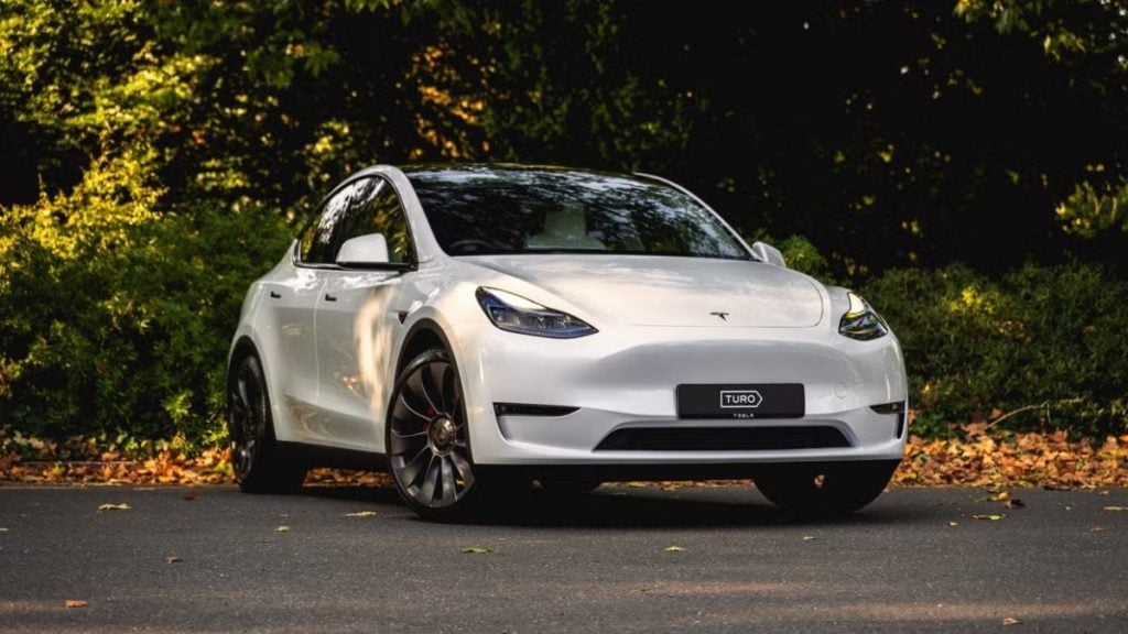 Tesla Model Y available for hire on Turo, offering flexible access to electric vehicles for low-emission driving.