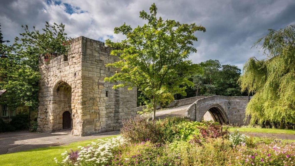 Medieval stone bridge crossing the River Coquet near Warkworth village, Northumberland, England