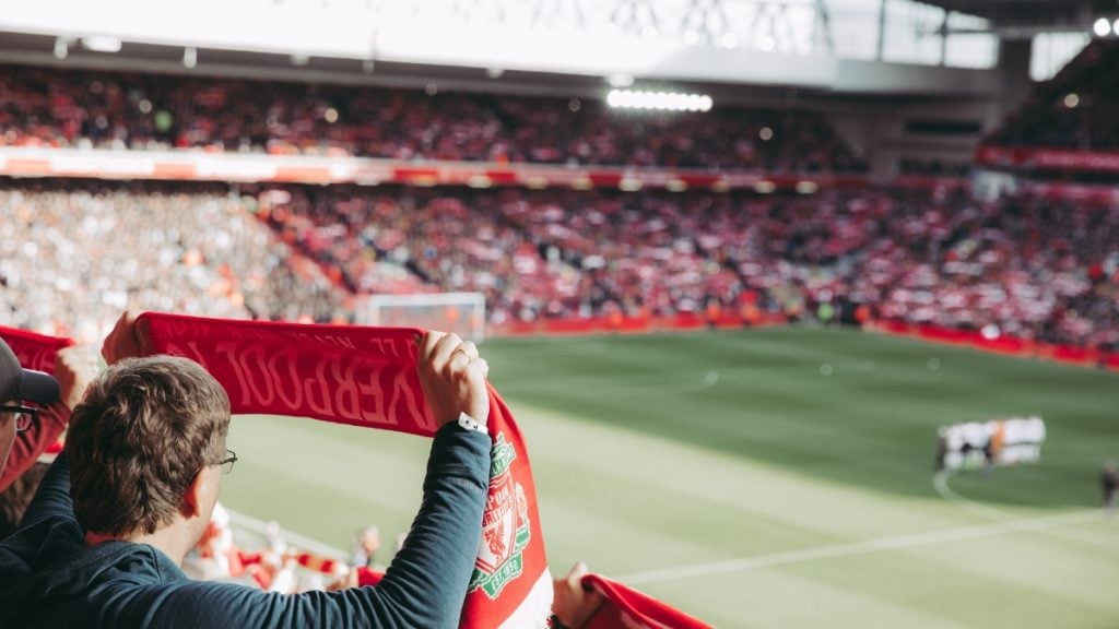 Your match day guide for every US soccer stadium. In photo: Fans cheering in stadium.