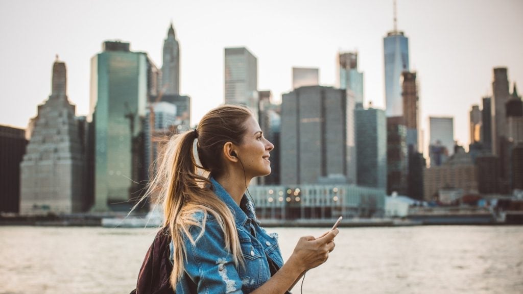 How to plan your trip to the world's largest soccer tournament. In photo: Tourist exploring city downtown