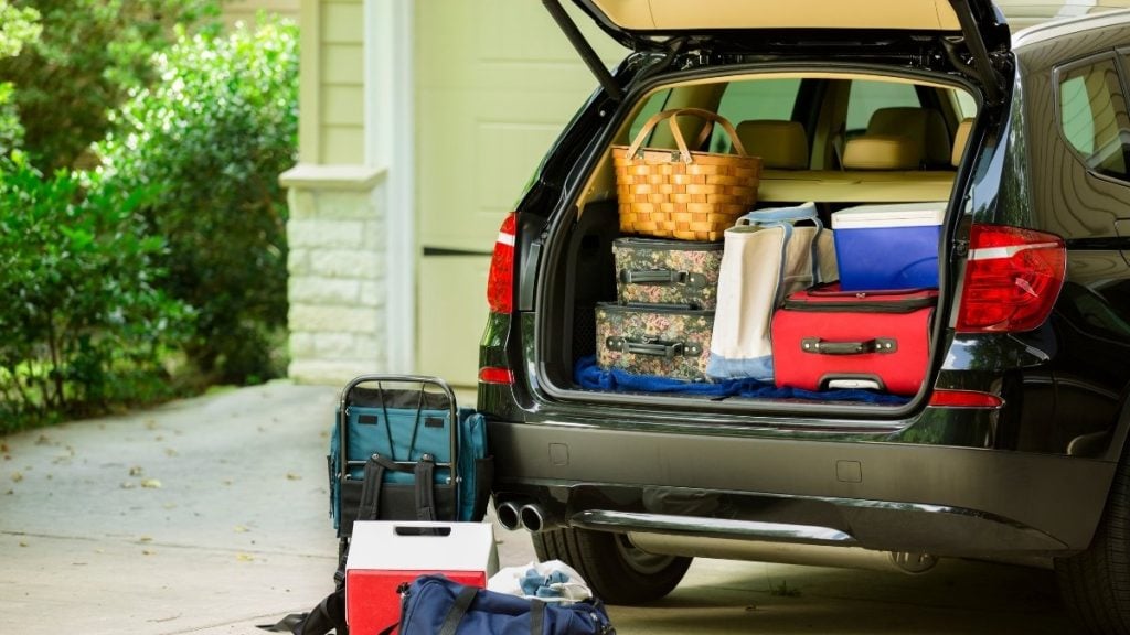 SUV trunk packed with luggage and bags ready for a road trip