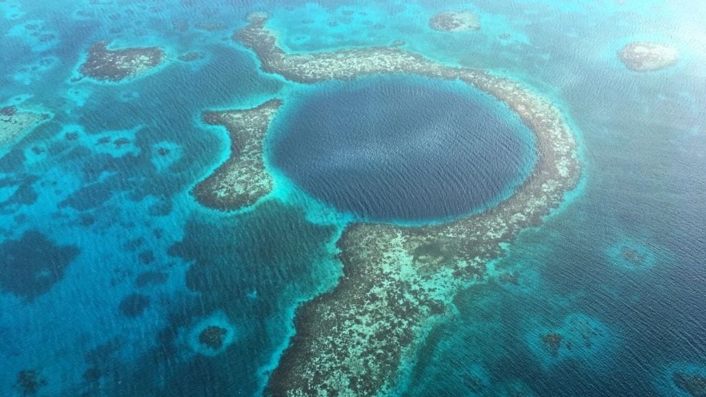 How to plan an unforgettable spring break trip. In photo: Great Blue Hole, Lighthouse Reef Atoll, Belize