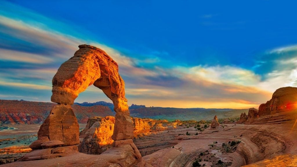 The best summer road trips in the US. In photo: Delicate Arch, Moab, Utah