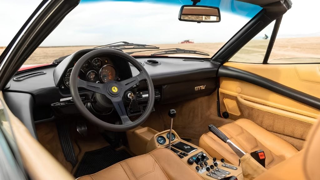 1982 Ferrari 308 GTS interior with tan leather, gated manual shifter, and analog Veglia gauges
